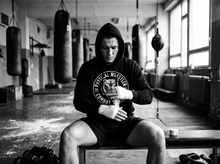 Load image into Gallery viewer, Physical Wrestler Hoodie — getting ready — black and white editorial