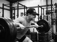 Load image into Gallery viewer, PHYSICAL Athlete Low Profile Mesh Back Trucker Hat — lifting — black and white editorial