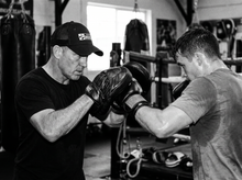 Load image into Gallery viewer, PHYSICAL Boxer Low Profile Mesh Back Trucker Hat — coaching — black and white editorial