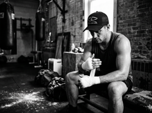 Load image into Gallery viewer, Combat Sports Low Profile Mesh Back Trucker Hat — getting ready — black and white editorial