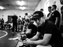 Load image into Gallery viewer, PHYSICAL Grappler Low Profile Mesh Back Trucker Hat — tournament — black and white editorial