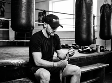 Load image into Gallery viewer, PHYSICAL Lifestyle Low Profile Mesh Back Trucker Hat — getting ready — black and white editorial