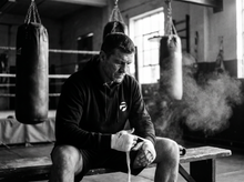 Load image into Gallery viewer, Athlete getting ready wearing the Physical Hooded Sweatshirt