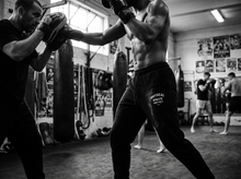 Load image into Gallery viewer, Physical Athlete Badge Sweats — coaching — black and white editorial