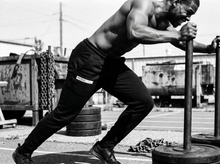 Load image into Gallery viewer, Get Physical Boxers Sweat Pants — running — black and white editorial