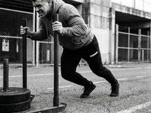 Load image into Gallery viewer, Physical Undercover Sweats (blue) — running — black and white editorial